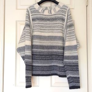 NWOT. H&M Woman's fluffy sweater with design.